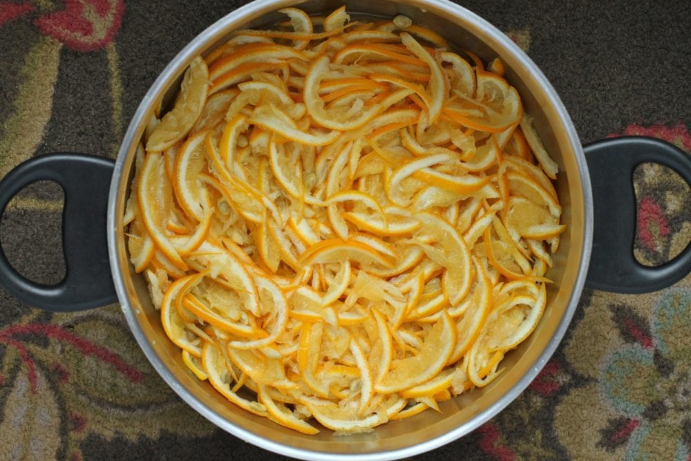 A saucepan full of very finely sliced lemon rind.