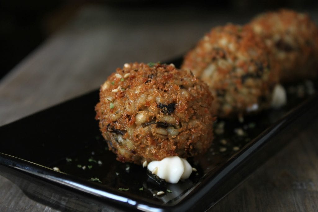 These Vegan Shiitake Mushroom Barley Arancini are a Japanese twist on an Italian favourite. This recipe uses nutritional yeast and seaweed to replicate the umami flavour of traditional Parmesan cheese. #barley #arancini #umami #appetizer #vegan #vegetarian