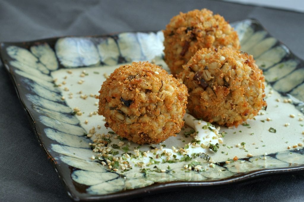 These Vegan Shiitake Mushroom Barley Arancini are a Japanese twist on an Italian favourite. This recipe uses nutritional yeast and seaweed to replicate the umami flavour of traditional Parmesan cheese. #barley #arancini #umami #appetizer #vegan #vegetarian