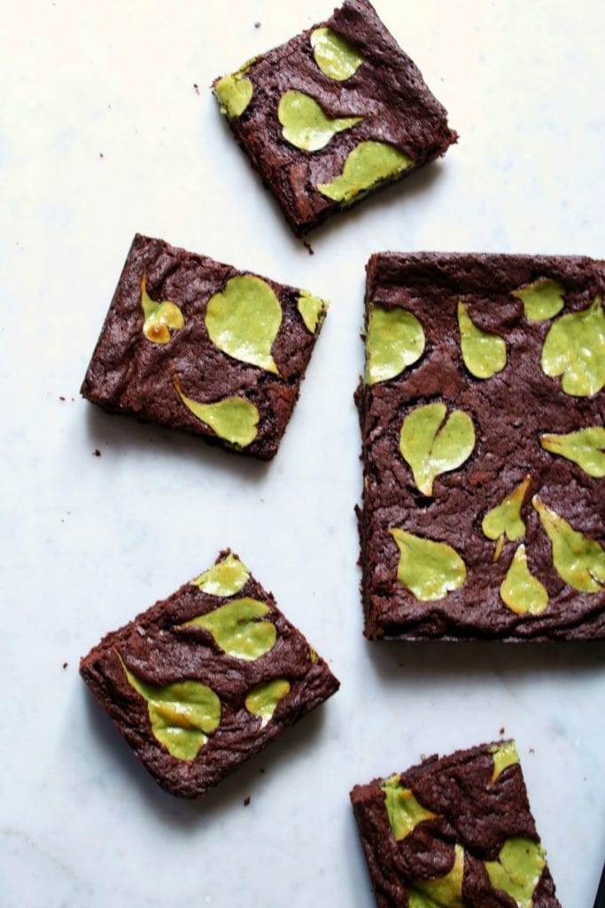 Squares of brownies on a marble background.