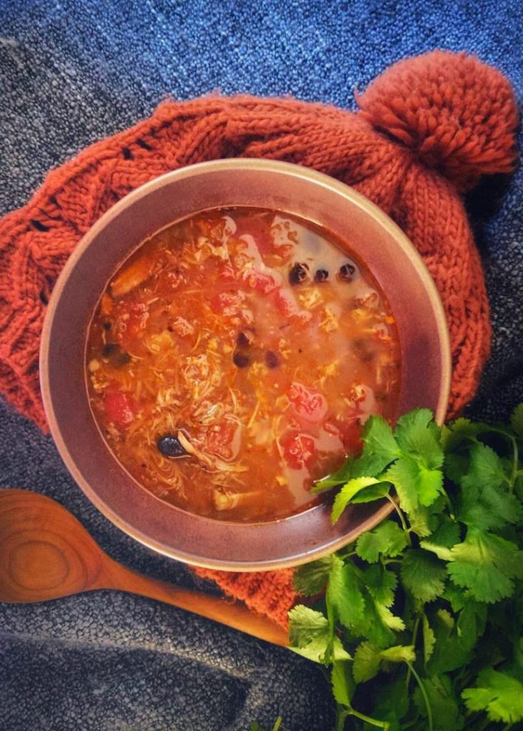 A lively and satisfying fridge soup made using leftover pork carnitas and black beans. #soup #leftovers #fridgesoup #porkcarnitassoup