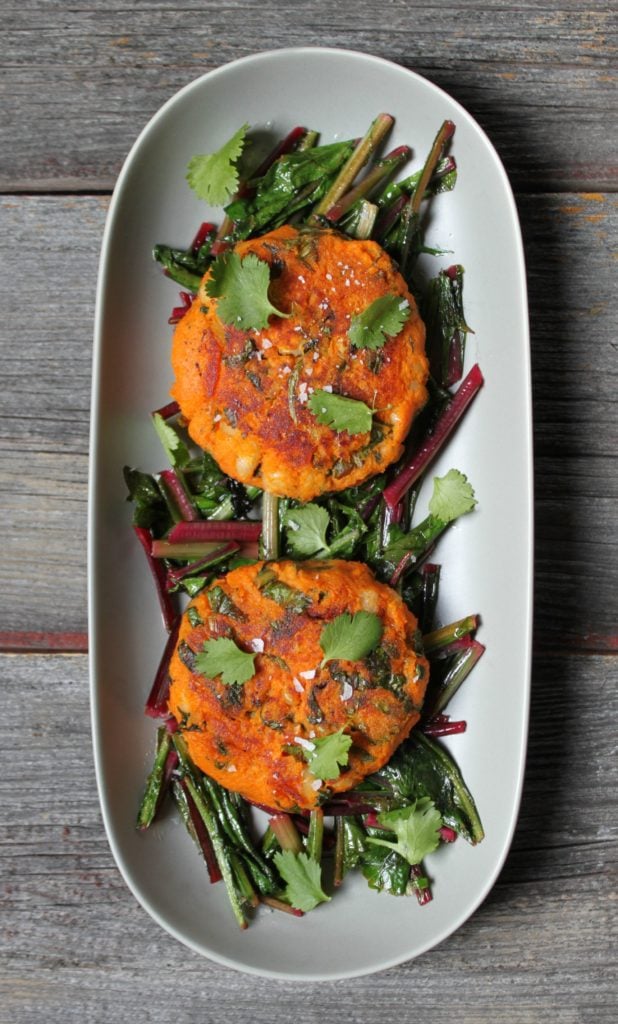 Foodies rejoice, you can have your lawn and eat it too! Celebrate the first signs of Spring with these Sweet Potato Patties on Sautéed Dandelion Greens. The sweet nature of the Sweet Potato Patties are a perfect companion to the bitter dandelion greens. Season with coarse flaky salt and enjoy! #vegan #sweetpotatoes #dandelion #foraged