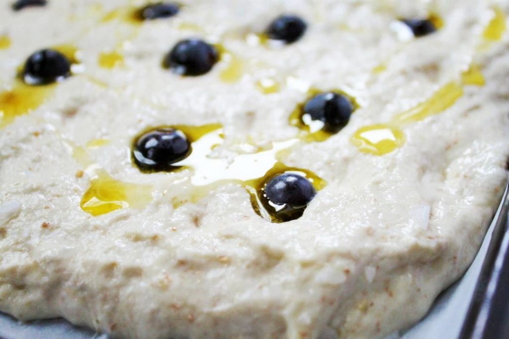 An easy to make sourdough focaccia recipe made even more delicious with concorde grapes, rosemary, olive oil, and sea salt. #sourdough #focaccia #sourdoughfocaccia