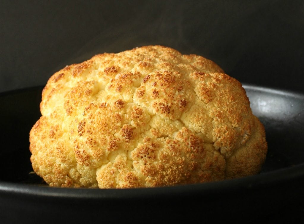 A Perfectly Roasted Whole Cauliflower is a wonderful thing and it's easier than you think. Here's how! #cauliflower #roastedcauliflower #wholecauliflower